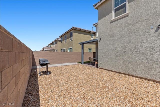 2293 Teatro Ave, Henderson, NV 89044 - view of yard featuring a fenced backyard and a patio