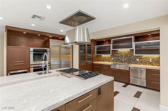 kitchen with open shelves, modern cabinets, a sink, decorative backsplash, and appliances with stainless steel finishes