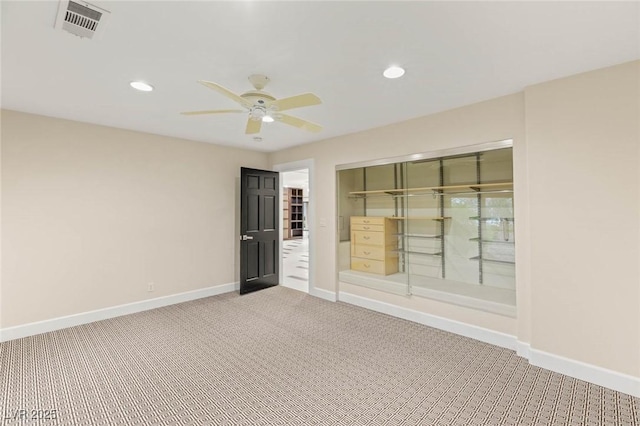 carpeted empty room with recessed lighting, visible vents, baseboards, and ceiling fan