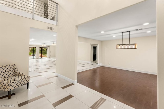 interior space with recessed lighting, visible vents, and baseboards