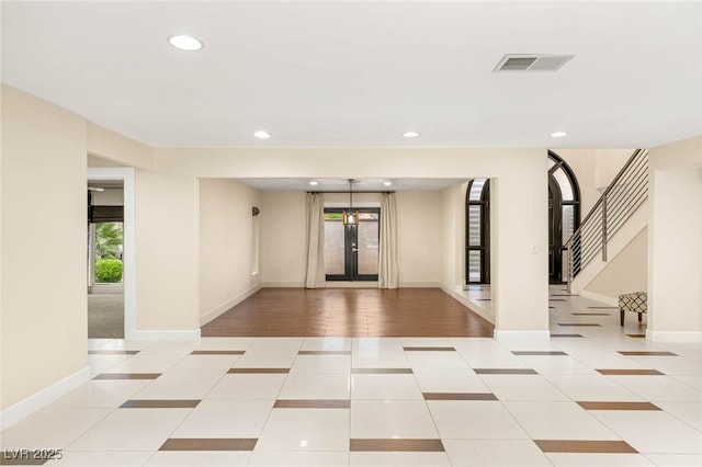 interior space with stairs and visible vents