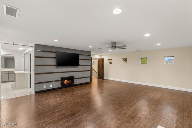 unfurnished living room featuring ceiling fan, recessed lighting, visible vents, and light wood-style flooring
