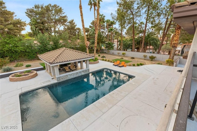 view of pool with a gazebo, fence, a patio area, and a fenced in pool