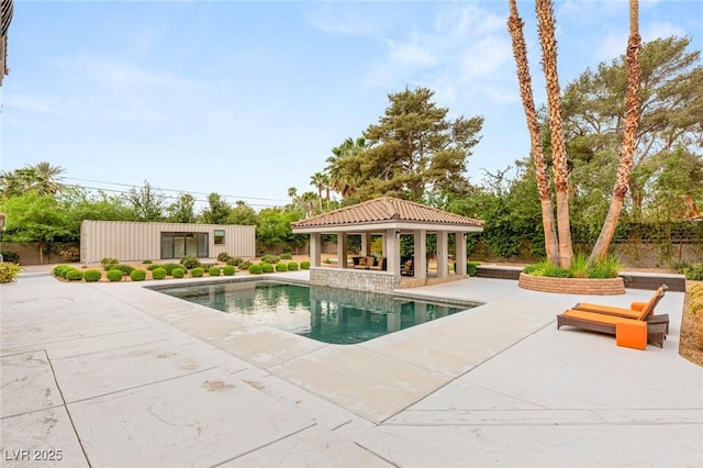 view of pool with fence, a fenced in pool, a gazebo, and a patio
