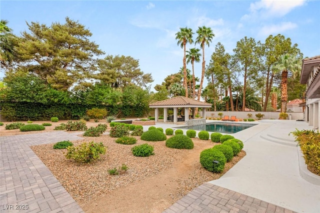 view of swimming pool with a gazebo, a fenced in pool, a patio area, and fence