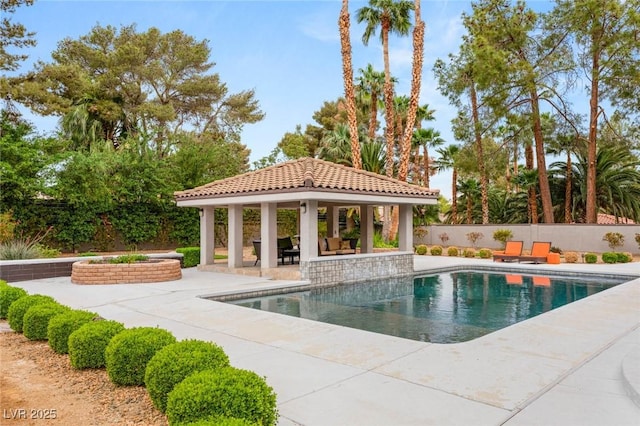 view of swimming pool with a gazebo, fence, a patio area, and a fenced in pool