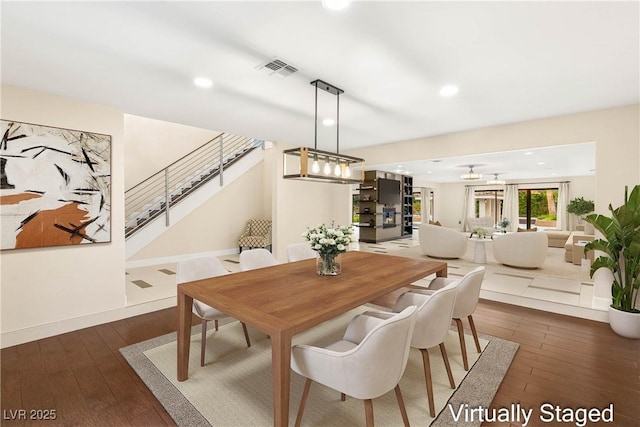 dining space with visible vents, recessed lighting, stairway, and wood-type flooring
