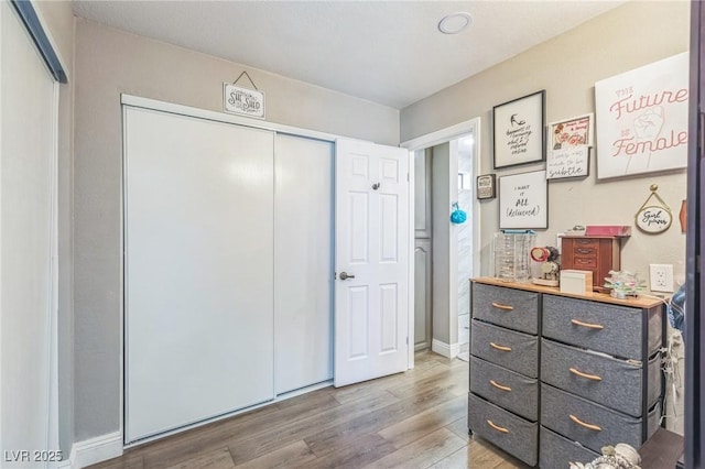 2111 River City Dr, Laughlin, NV 89029 - bedroom featuring light wood-style flooring, a closet, and baseboards