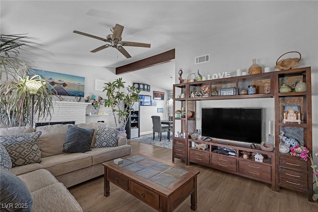 2111 River City Dr, Laughlin, NV 89029 - living area with a ceiling fan, a fireplace, wood finished floors, and baseboards