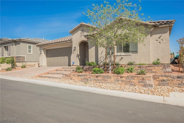 10126 Cliff Dwellings Ave, Las Vegas, NV 89178 - mediterranean / spanish home with stucco siding, a tiled roof, a garage, and driveway