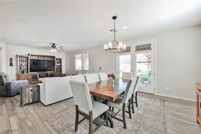 10126 Cliff Dwellings Ave, Las Vegas, NV 89178 - dining space with a chandelier, light wood finished floors, ceiling fan, baseboards, and recessed lighting