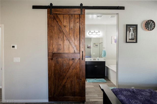 10126 Cliff Dwellings Ave, Las Vegas, NV 89178 - full bath featuring vanity, wood finished floors, and a bath