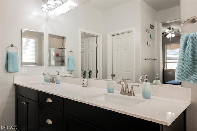 10126 Cliff Dwellings Ave, Las Vegas, NV 89178 - bathroom with double vanity and a ceiling fan