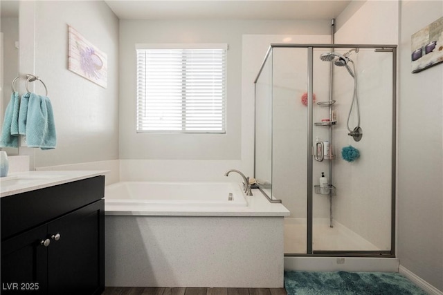 10126 Cliff Dwellings Ave, Las Vegas, NV 89178 - bathroom featuring a garden tub, a stall shower, and vanity