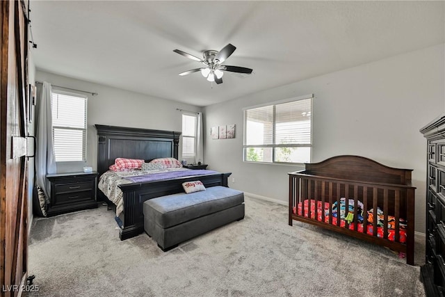 10126 Cliff Dwellings Ave, Las Vegas, NV 89178 - carpeted bedroom with baseboards and a ceiling fan