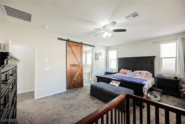 10126 Cliff Dwellings Ave, Las Vegas, NV 89178 - carpeted bedroom featuring a barn door, multiple windows, baseboards, and a ceiling fan