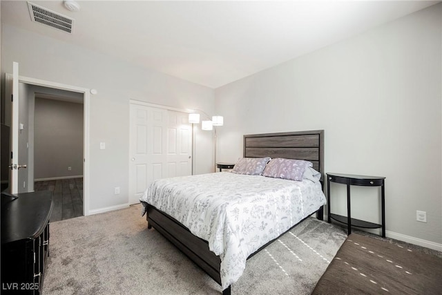 bedroom featuring baseboards, carpet, a closet, and visible vents