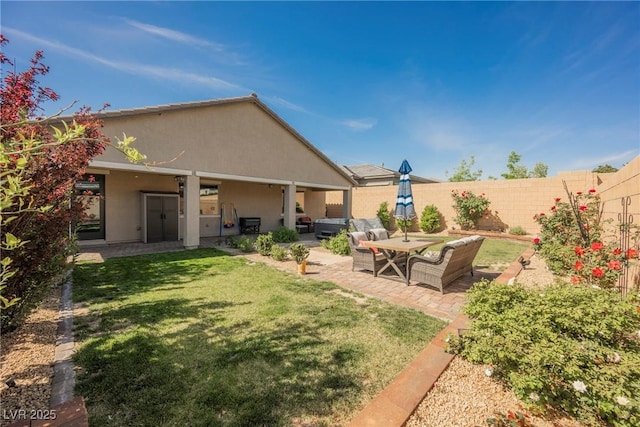 10126 Cliff Dwellings Ave, Las Vegas, NV 89178 - view of yard with a patio area and outdoor lounge area