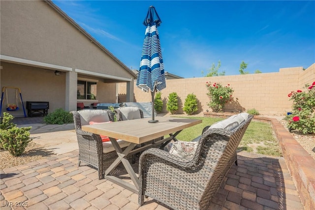 view of patio / terrace featuring outdoor dining area and a fenced backyard