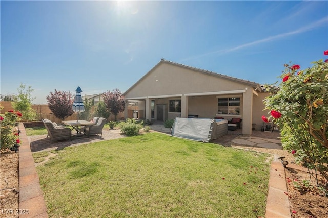 10126 Cliff Dwellings Ave, Las Vegas, NV 89178 - rear view of house with a patio area, stucco siding, and an outdoor living space