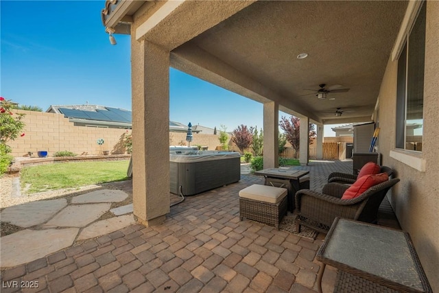 10126 Cliff Dwellings Ave, Las Vegas, NV 89178 - fenced backyard with a hot tub, a patio, a ceiling fan, and outdoor dining space