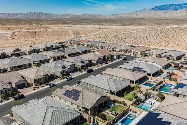 birds eye view of property with a residential view, view of desert, and a mountain view