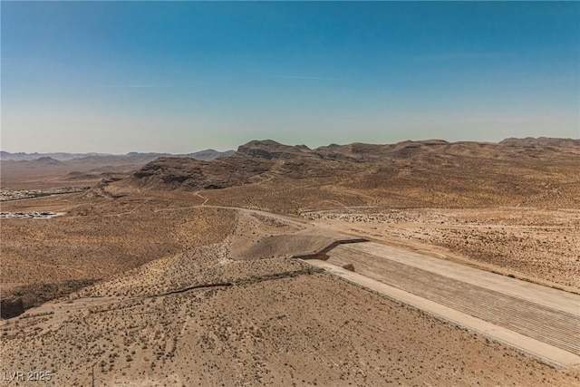view of mountain feature featuring a rural view and view of desert