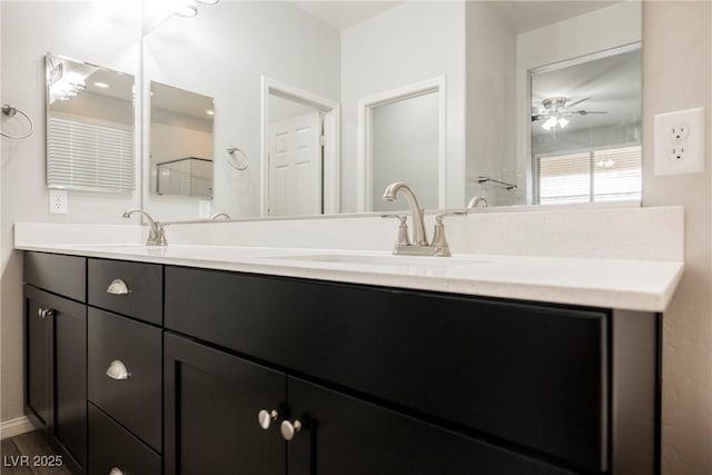10126 Cliff Dwellings Ave, Las Vegas, NV 89178 - bathroom with double vanity, a ceiling fan, and wood finished floors