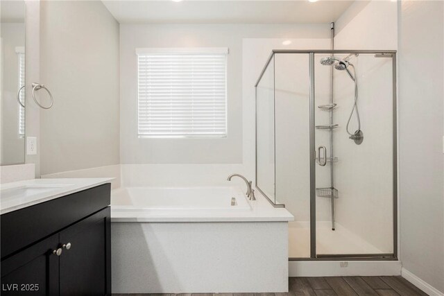 10126 Cliff Dwellings Ave, Las Vegas, NV 89178 - bathroom featuring a shower stall, vanity, a bath, and wood finished floors