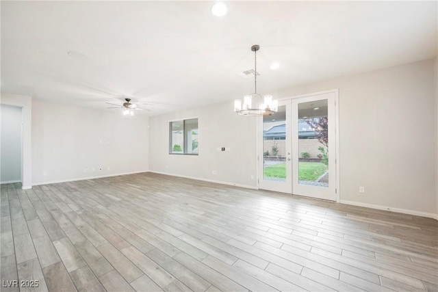 10126 Cliff Dwellings Ave, Las Vegas, NV 89178 - spare room with a chandelier, ceiling fan, wood finished floors, and recessed lighting