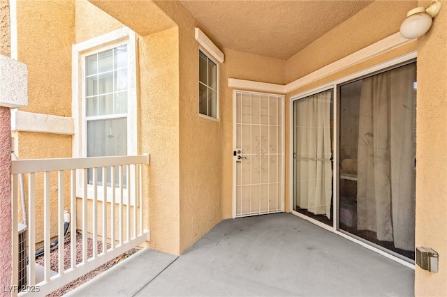 5855 Valley Dr Unit 1101, North Las Vegas, NV 89031 - entrance to property with stucco siding and a patio area