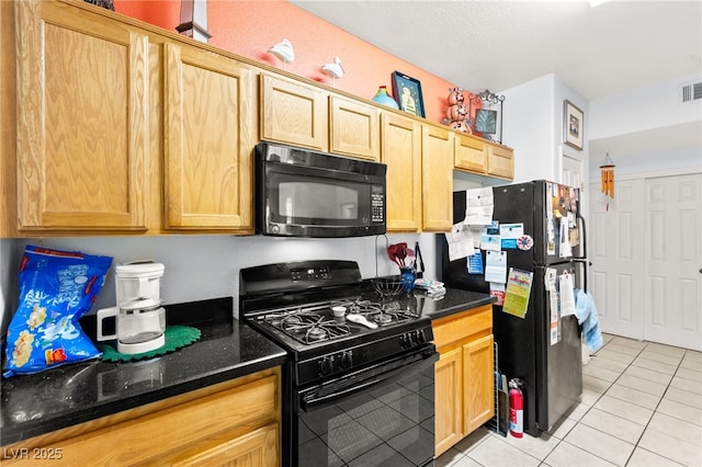 5855 Valley Dr Unit 1101, North Las Vegas, NV 89031 - kitchen featuring light brown cabinets, black appliances, light tile patterned flooring, and dark stone counters