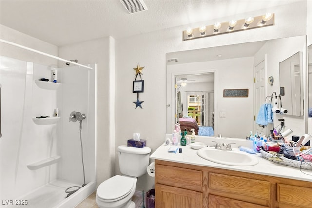 5855 Valley Dr Unit 1101, North Las Vegas, NV 89031 - bathroom featuring visible vents, toilet, vanity, ensuite bath, and a stall shower