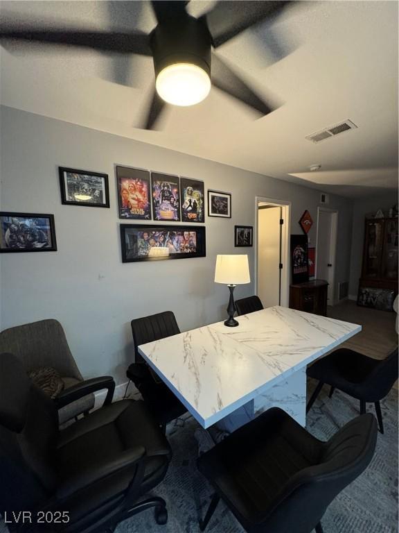 dining room featuring carpet and visible vents