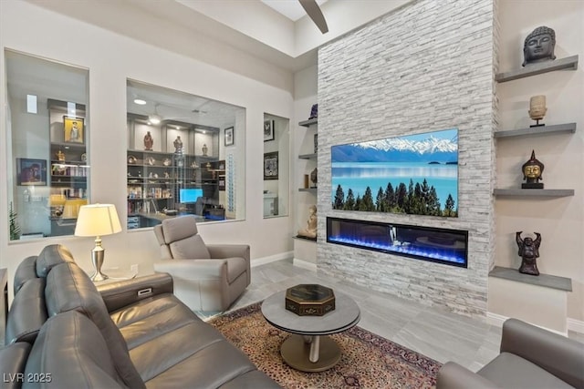 10018 Regency Square Ave, Las Vegas, NV 89148 - living area with a stone fireplace, built in features, and a ceiling fan