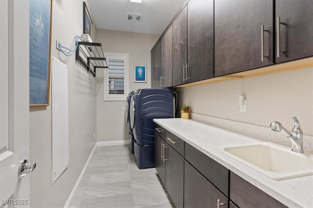 10018 Regency Square Ave, Las Vegas, NV 89148 - laundry area with cabinet space and light marble finish floors