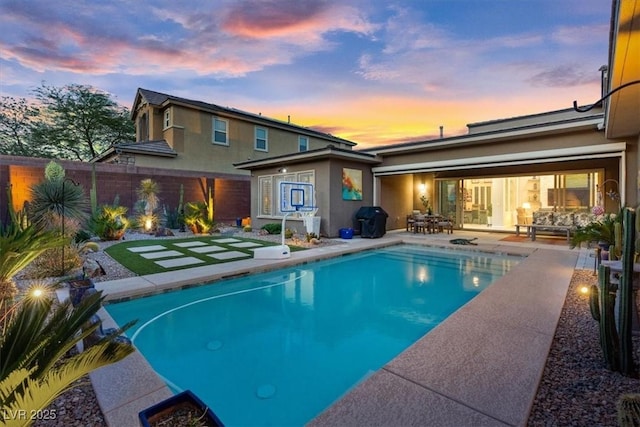 10018 Regency Square Ave, Las Vegas, NV 89148 - pool at dusk with a patio