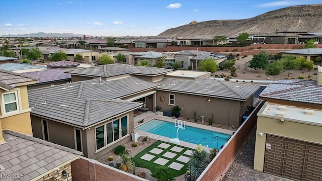 10018 Regency Square Ave, Las Vegas, NV 89148 - view of pool featuring a residential view, a mountain view, and a fenced backyard