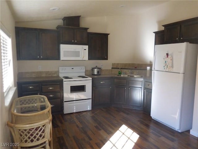 593 Ogden Ave, Ely, NV 89301 - kitchen featuring a sink, white appliances, dark brown cabinetry, lofted ceiling, and dark wood-type flooring