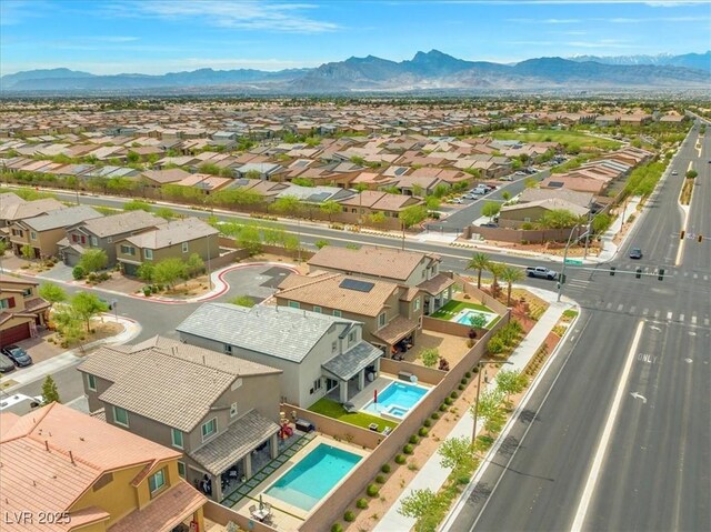 aerial view with a mountain view and a residential view