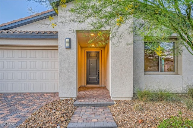 26 Sun Mirage Ave, Henderson, NV 89011 - doorway to property featuring stucco siding and a tile roof