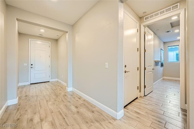 26 Sun Mirage Ave, Henderson, NV 89011 - corridor with baseboards, visible vents, and light wood-type flooring