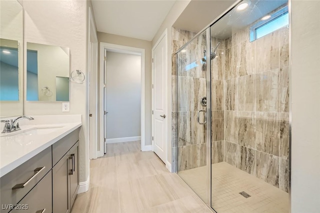26 Sun Mirage Ave, Henderson, NV 89011 - full bathroom featuring baseboards, vanity, and a stall shower