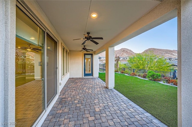 26 Sun Mirage Ave, Henderson, NV 89011 - view of patio featuring fence, ceiling fan, and a mountain view