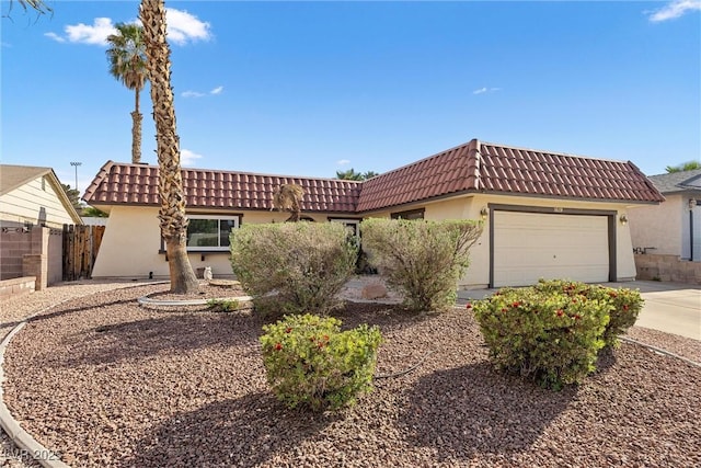 1619 Abby Ave, Henderson, NV 89014 - view of front of property with a tiled roof, stucco siding, driveway, and an attached garage