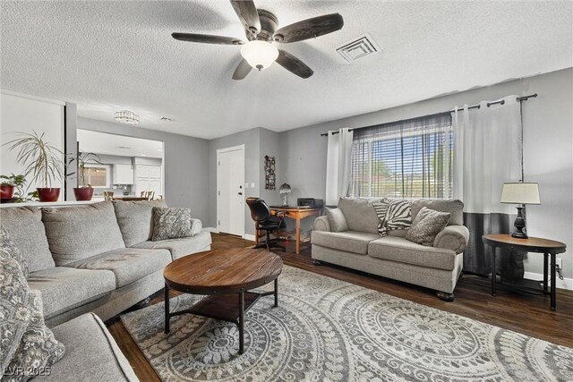 1619 Abby Ave, Henderson, NV 89014 - living area featuring wood finished floors, ceiling fan, and a textured ceiling