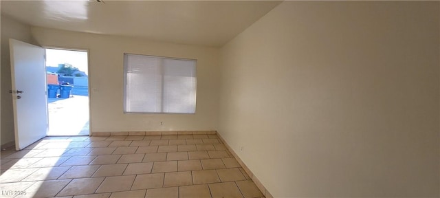 2740 Vita Dr, North Las Vegas, NV 89030 - tiled empty room with baseboards
