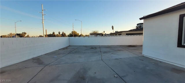 2740 Vita Dr, North Las Vegas, NV 89030 - patio terrace at dusk with a fenced backyard