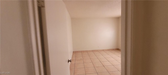 2740 Vita Dr, North Las Vegas, NV 89030 - spare room featuring baseboards and light tile patterned flooring