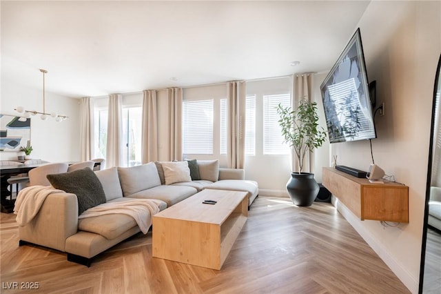 living area featuring baseboards